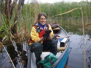 Researcher Julia Lazar holds a recently collected subaqueous soil core along Roaring Brook in Washington County, R.I. Image Credit: Richard A. McKinney