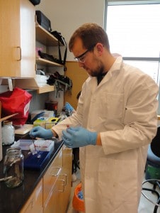 Miller prepares a DNA sample for analysis. ©David Munoz 