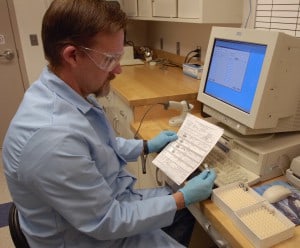 NWRC Biological Science Technician Kevin Bentler enters data on wild bird samples collected for avian influenza testing. Since December 2003, the Asian HPAI H5N1 virus (below) has resulted in high mortality in poultry and wild birds in Asia, the Middle East, Europe and Africa. Image courtesy of USDA.