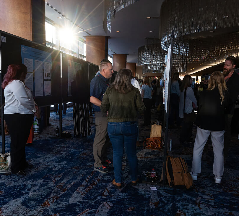 wildlife professionals network at a symposia session at TWS annual conference