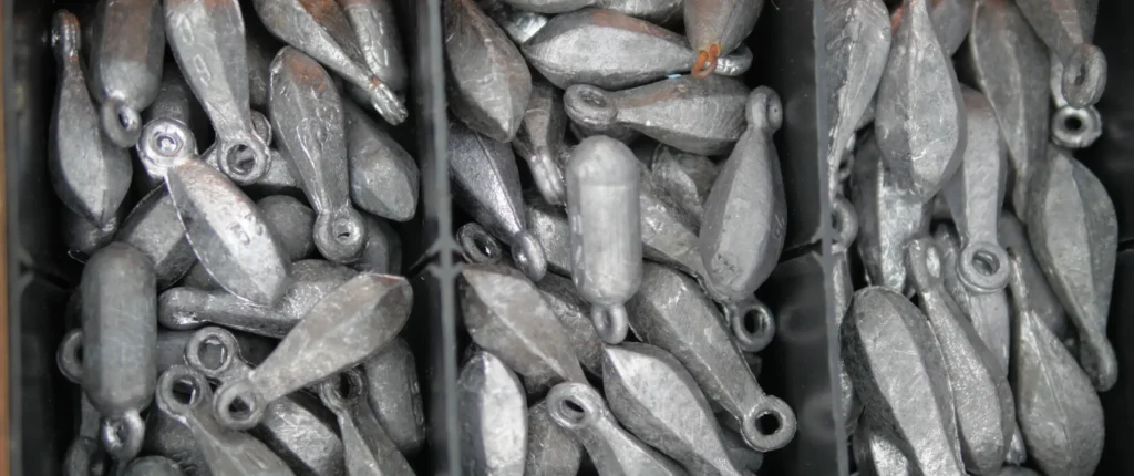 Box of lead fishing sinkers showing a common source of toxic pollution that threatens birds, fish, and aquatic wildlife.