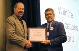 Vince Burke accepted the award on behalf of the late Guy Baldassarre.