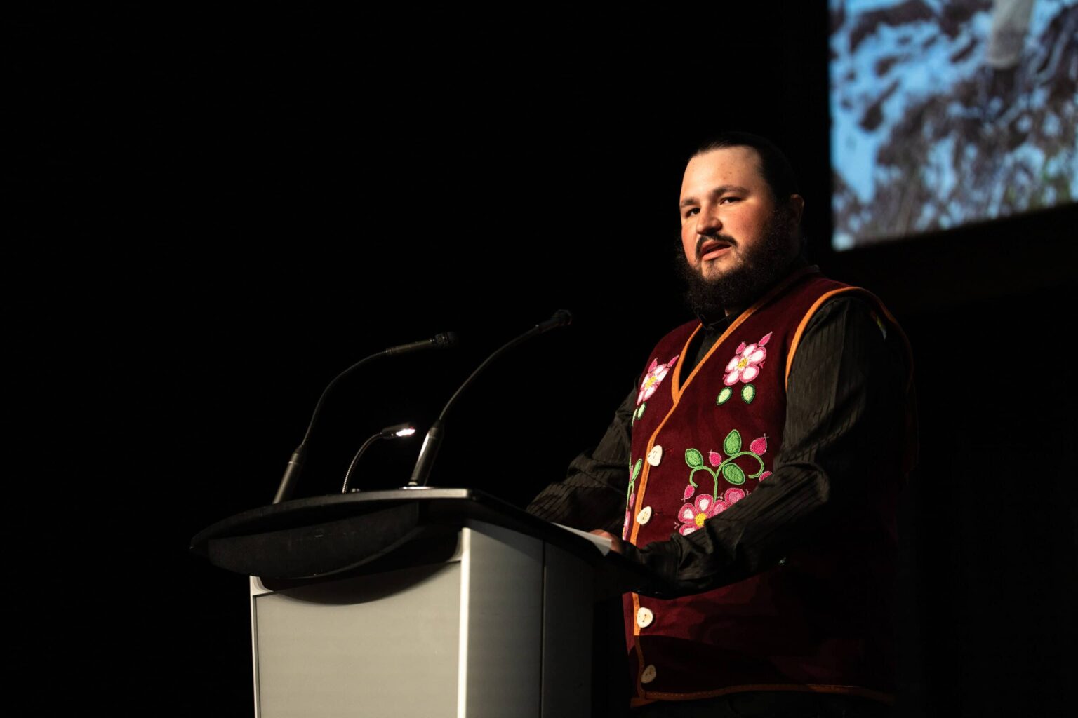 Remington Bracher, a Nêhiyaw (Cree) member of Muskoday First Nation, speaks at the plenary during The Wildlife Society's Annual Conference in Edmonton, Alberta. Credit: Katie Perkins/TWS