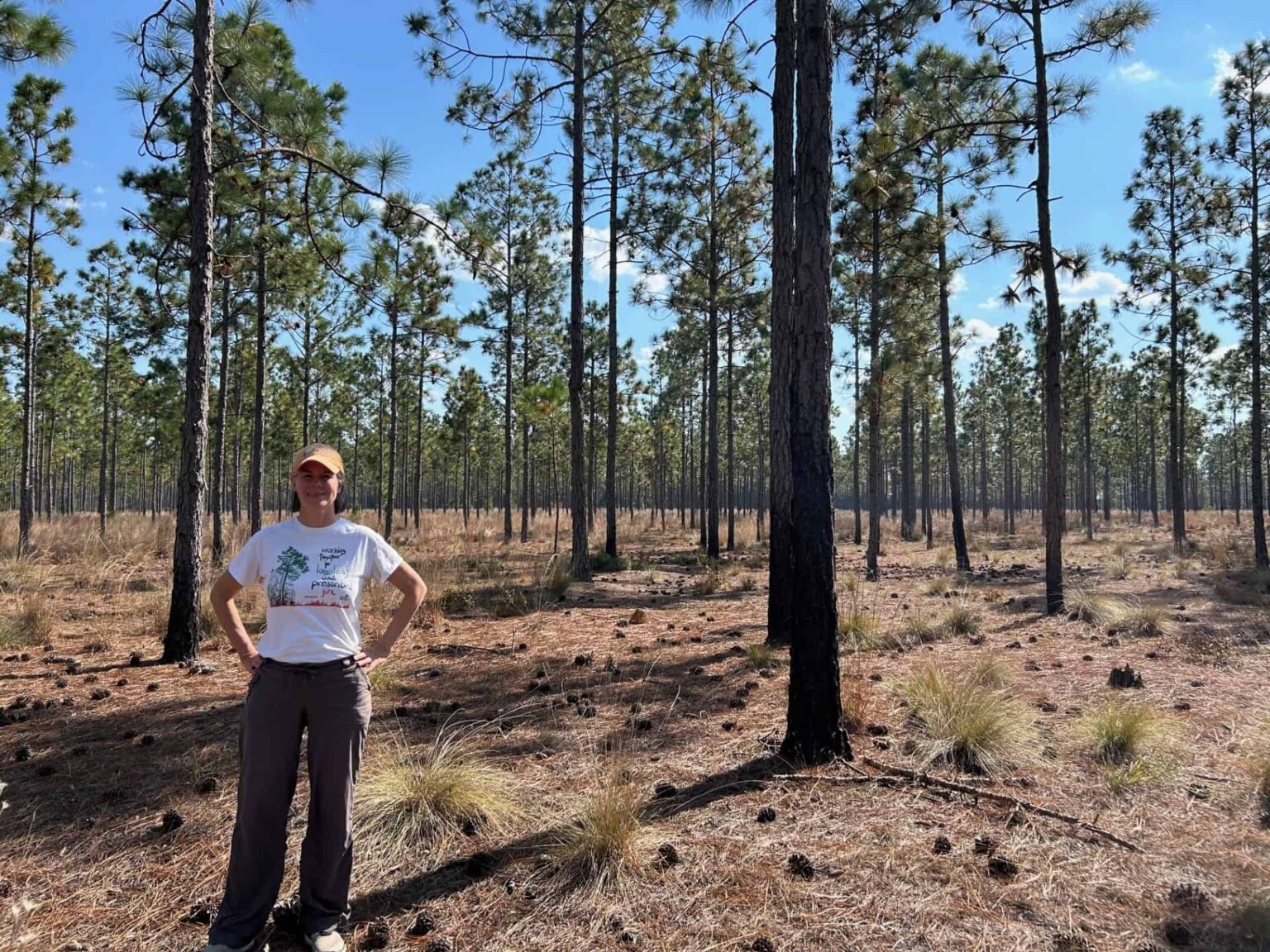John-Ann Shearer standing among pine trees