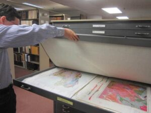 Student volunteer explores the historic USGS map collection. ©USGS, Public domain
