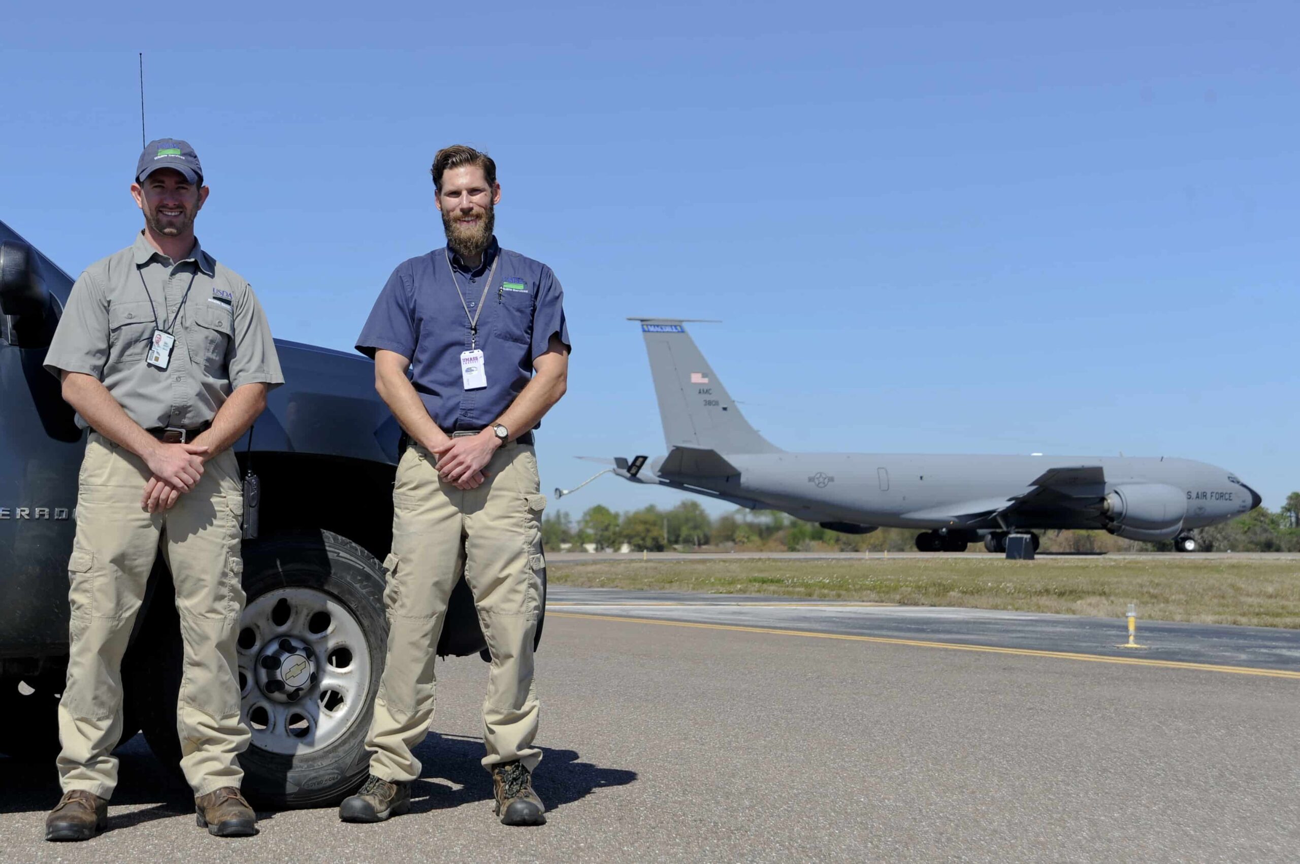 Ryan Lynch and Kory McLellan with a Stratotanker in the background.