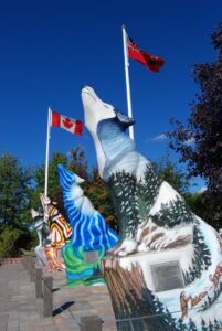 Painted 7.5 feet concrete statues of wolves are one of the attractions in Thompson, Manitoba. Tourists are encouraged to participate in a GPS Wolf Hunt, where their mission is to find all of the statues across Winnipeg, Thompson and Churchill by their GPS coordinates. Image Credit: © Volker Beckmann 