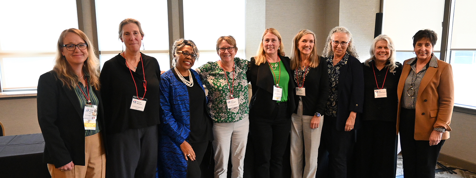 Group of women wildlife professionals all posing and smiling